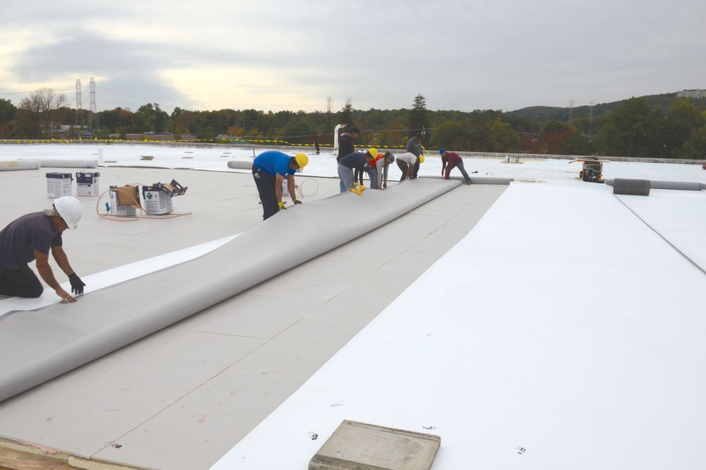 Two roofers installing a Residential Roof